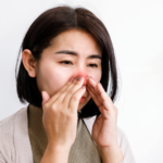 Woman with sinusitis or allergy